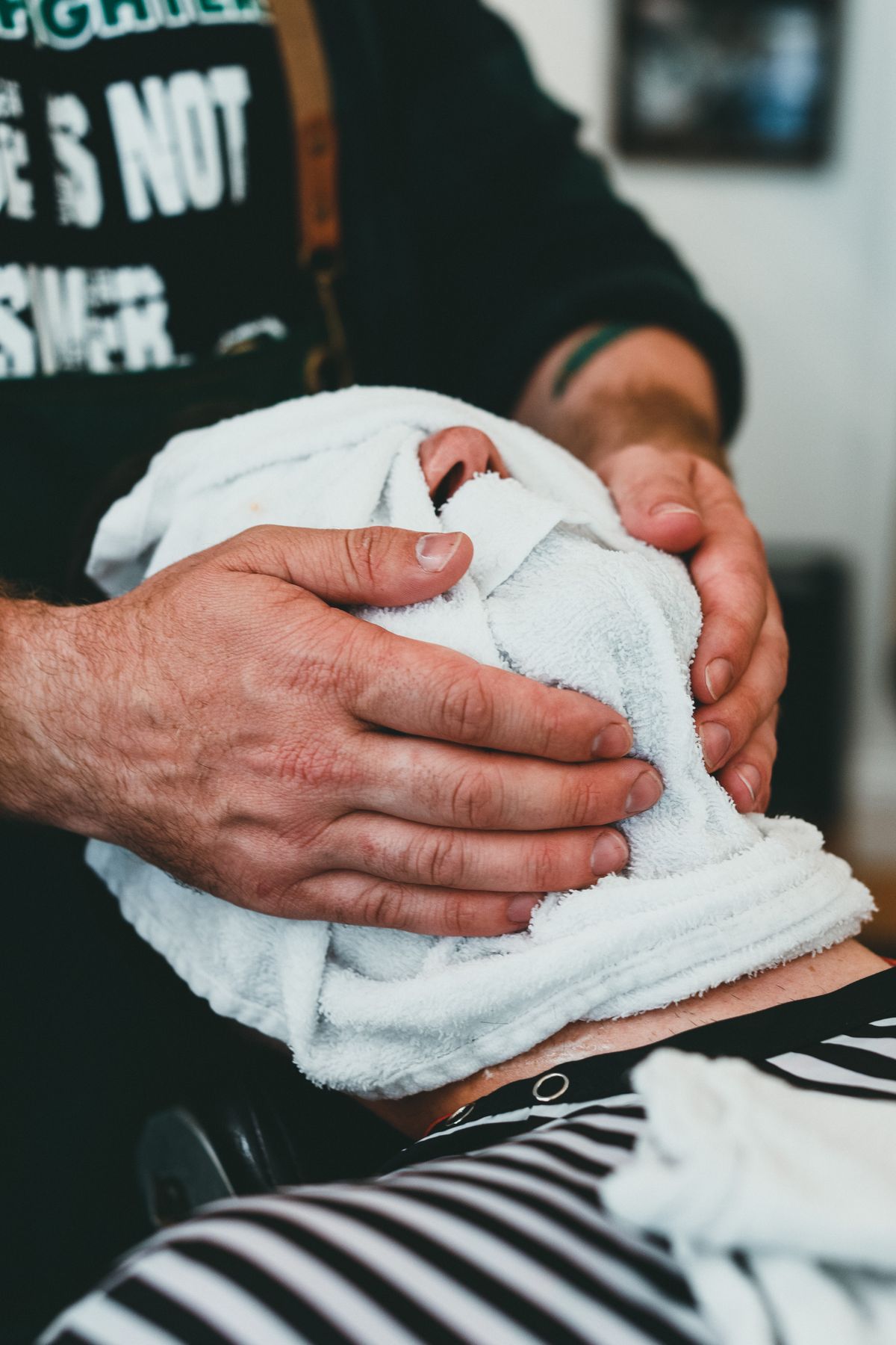 Male client receiving a relaxing head massage